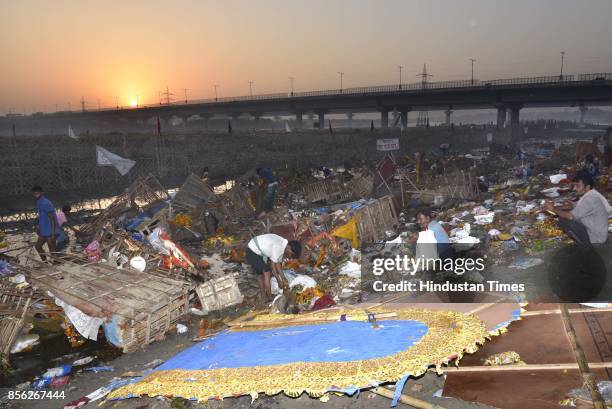 Water pollution due to immersion of Goddess Durga idols after the celebration of 9-day long festival of Durga Puja at Yamuna River Bank near ISBT, on...