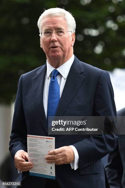 Britain's Defence Secretary Michael Fallon arrives at the Midland Hotel on the first day of the Conservative Party annual conference, at the...
