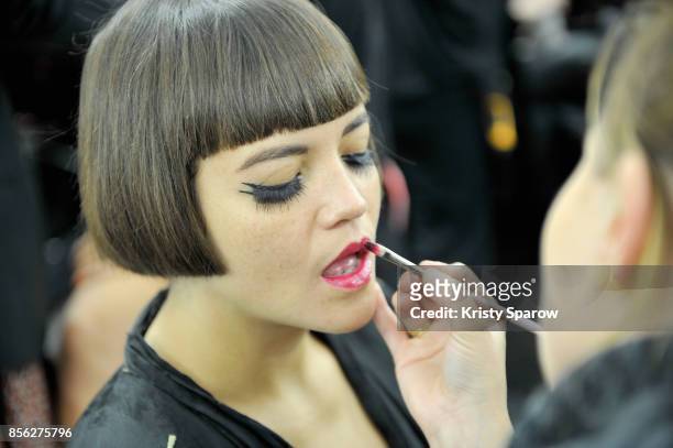 Model prepares backstage prior Le Defile L'Oreal Paris as part of Paris Fashion Week Womenswear Spring/Summer 2018 at Avenue Des Champs Elysees on...