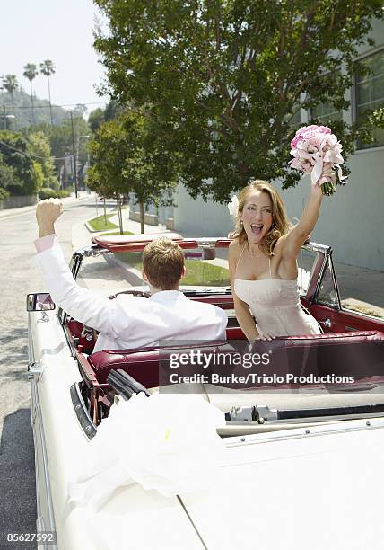 bride and groom in car - bride and groom wedding car stock pictures, royalty-free photos & images