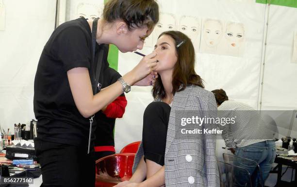 Model prepares backstage prior Le Defile L'Oreal Paris as part of Paris Fashion Week Womenswear Spring/Summer 2018 at Avenue Des Champs Elysees on...