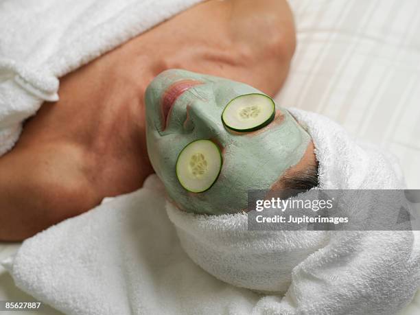 woman wearing beauty mask - health spa stock pictures, royalty-free photos & images