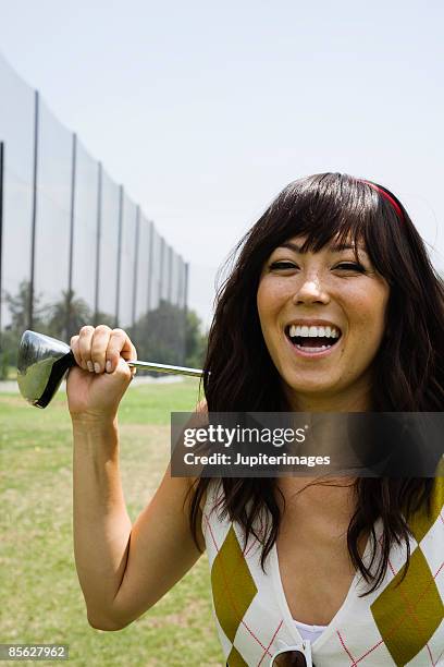 smiling golfer - driving range stock pictures, royalty-free photos & images