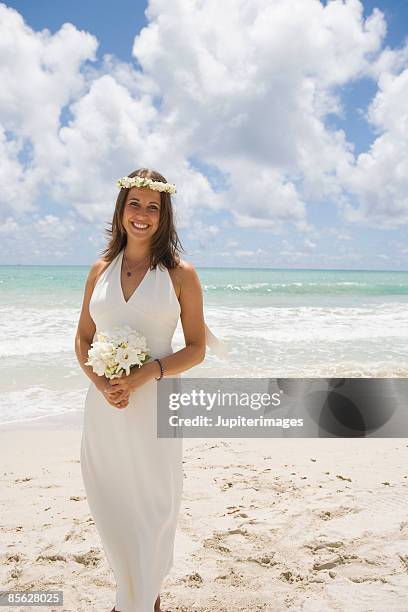 smiling bride on beach - lei day hawaii stock-fotos und bilder