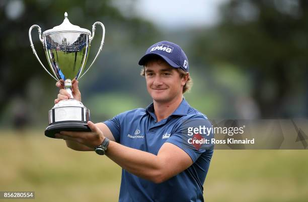 Paul Dunne of Ireland celebrates with the trophy during day four of the British Masters at Close House Golf Club on October 1, 2017 in Newcastle upon...