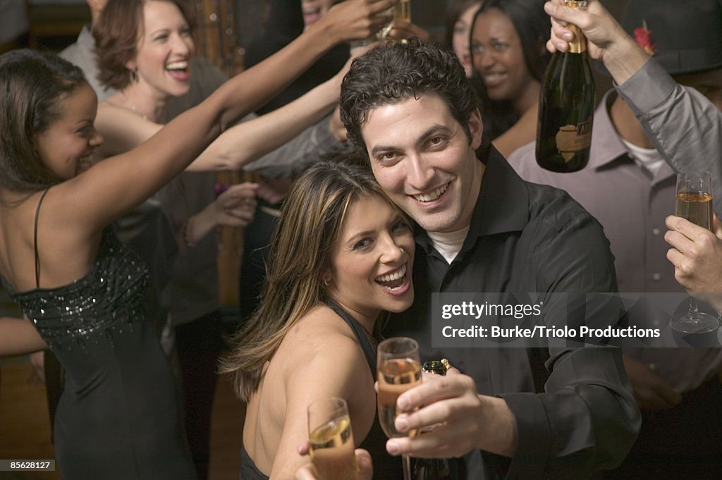 Couple with drinks at party