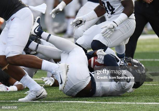 Nevada Wolf Pack defensive back Asauni Rufus recovers a fumble during the game between the Nevada Wolfpack and the Washington State Cougars on...