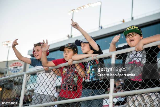 Young fans cheer during the Las Vegas 350 NASCAR Camping World Trucks Series playoff race on September 30, 2017 at Las Vegas Motor Speedway in Las...