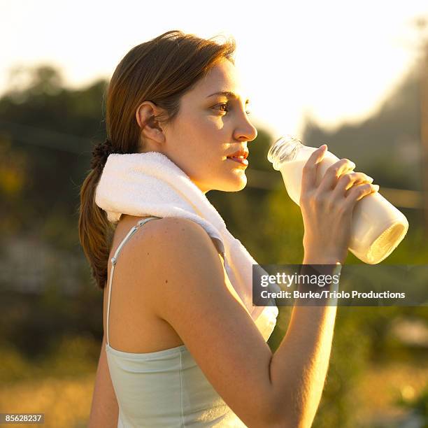 woman drinking milk - calcio sport imagens e fotografias de stock