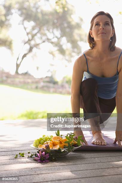 woman stretching - bwl stock-fotos und bilder