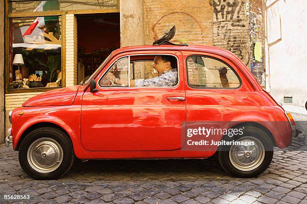angry man sitting in car - ongeduldig stockfoto's en -beelden