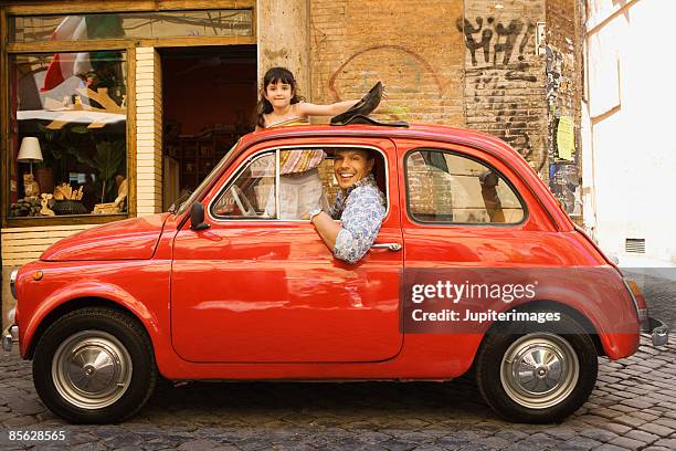 smiling father in car with playful daughter - classic mens day 6 photos et images de collection