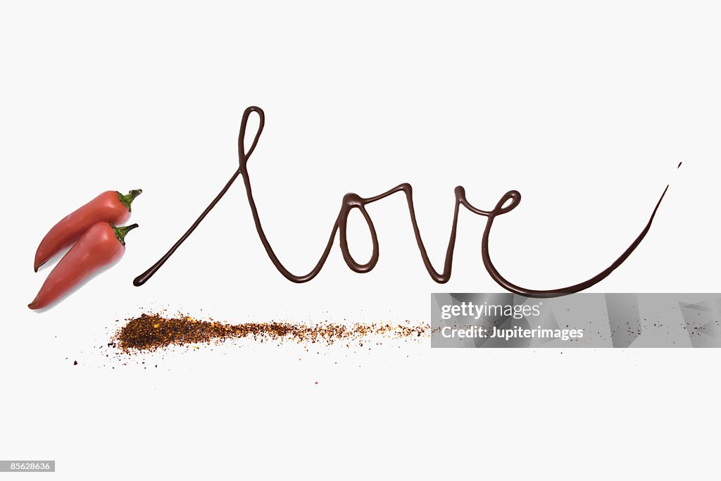 Love written in chocolate with chiles and chile powder