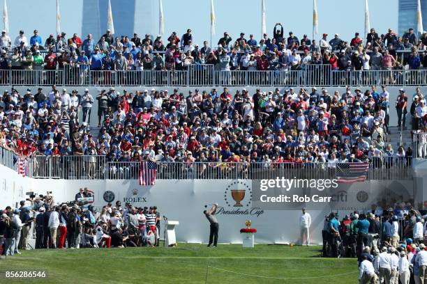 Jason Day of Australia and the International Team plays his shot from the first tee during Sunday singles matches of the Presidents Cup at Liberty...