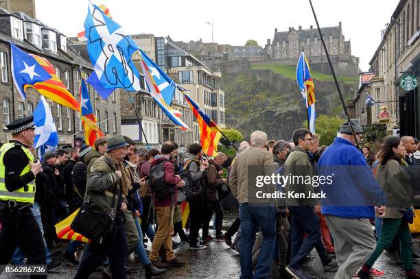 Pro-Catalonia demonstrators march through the West End of Edinburgh with Edinburgh Castle in the background, on the day Catalonia attempted to hold a...