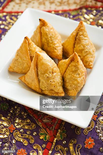 plate of samosas - samosa stock pictures, royalty-free photos & images