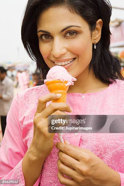 woman eating ice cream - eating kulfi stock pictures, royalty-free photos & images