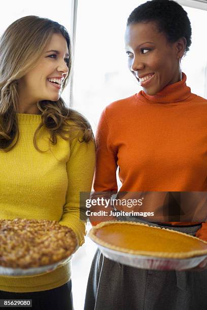 smiling friends holding pies - apple pie a la mode stock pictures, royalty-free photos & images
