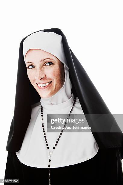 smiling nun wearing rosary - nun isolated stock pictures, royalty-free photos & images