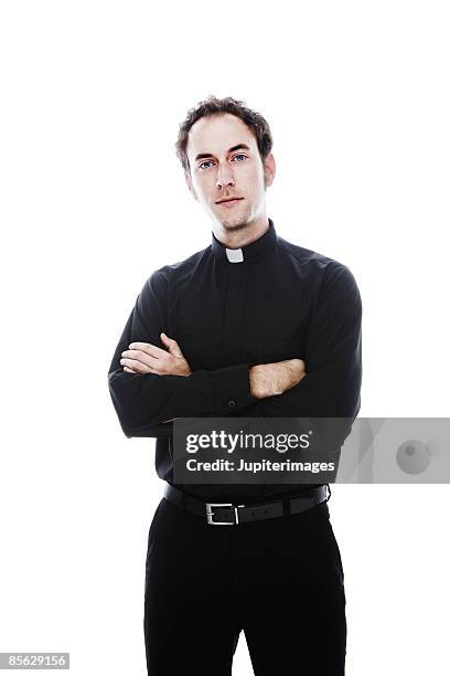 priest standing with arms folded - 司祭 ストックフォトと画像