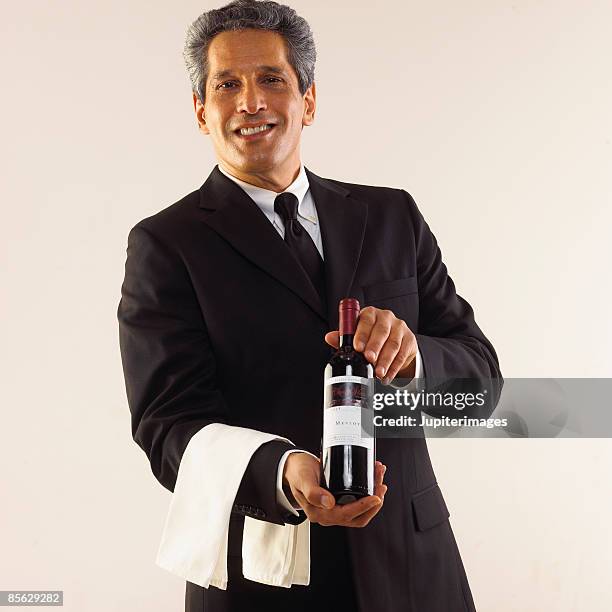 sommelier with wine - sommelier stockfoto's en -beelden