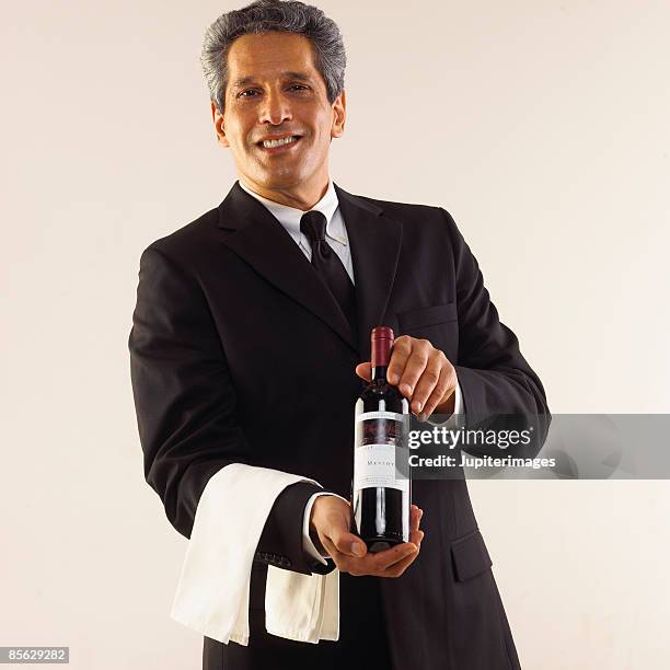 sommelier with wine - sommelier stock pictures, royalty-free photos & images