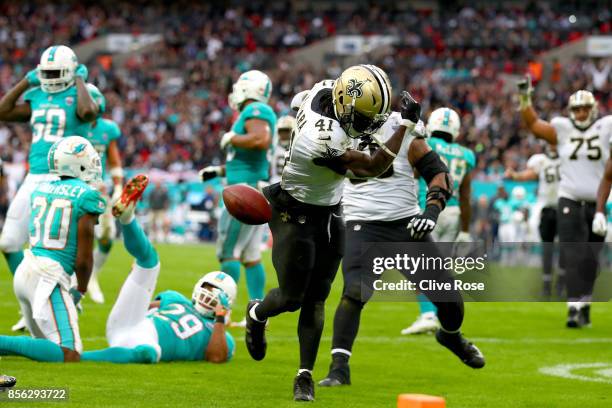 Alvin Kamara of the New Orleans Saints celebrates his touchdown during the NFL match between New Orleans Saints and Miami Dolphins at Wembley Stadium...