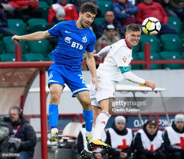 Igor Denisov of FC Lokomotiv Moscow vies for the ball with Anton Sosnin of FC Dinamo Moscow during the Russian Premier League match between FC...