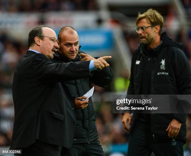 Newcastle United's Manager Rafael Benitez speaks with Fourth Official Bobby Madley during the Premier League Match between Newcastle United and...