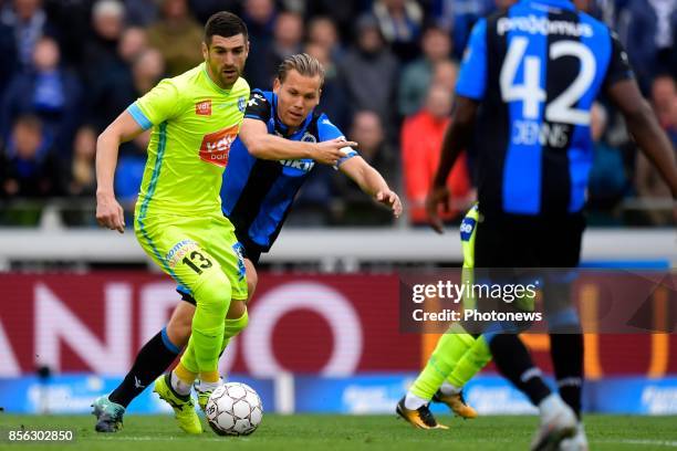 Ruud Vormer midfielder of Club Brugge battles for the ball with Stefan Mitrovic defender of KAA Gent during the Jupiler Pro League match between Club...