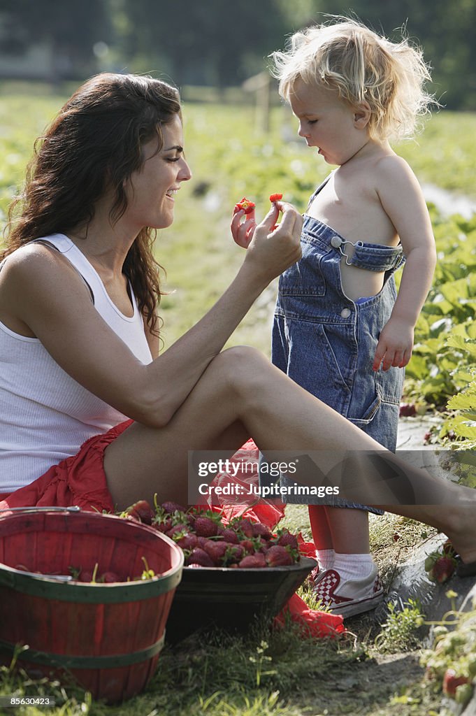 Mother and child with strawberries