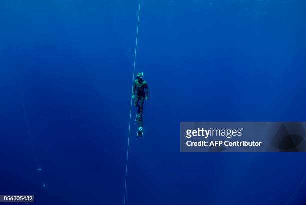 Man competes in the constant weight category during a freediving competition off the coast of Salamis in the self-proclaimed Turkish Republic of...