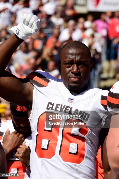 Randall Telfer of the Cleveland Browns raises a fist in the air during the Nation Anthem before the game against the Cincinnati Bengals at...