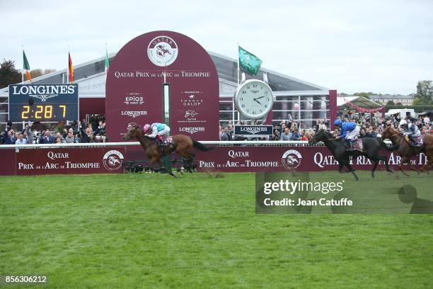 Frankie Dettori of Italy riding 'Enable' wins in front of second Mickael Barzalona riding 'Cloth of Stars' and third Jim Crowley riding 'Ulysses' the...