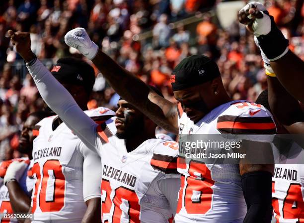 Briean Boddy-Calhoun and Christian Kirksey of the Cleveland Browns hold their fists in the air during the National Anthem before the game against the...