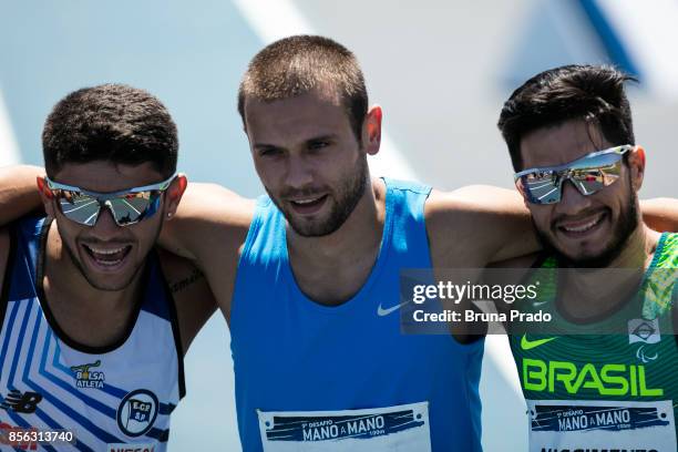 Paralympic athletes Petrucio Ferreira of Brazil, Yohansson Nascimento of Brazil and Michal Derus of Poland during the Mano a Mano Athletics Challenge...