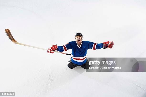hockey player yelling - hockey rink ice stock pictures, royalty-free photos & images
