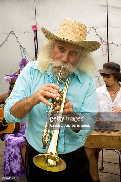 man playing trumpet - brass instrument stock pictures, royalty-free photos & images