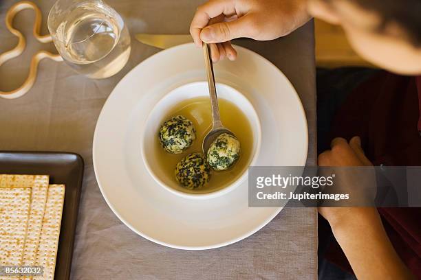 matzoh ball soup - passover seder stock-fotos und bilder