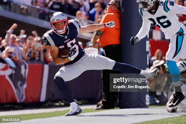 Chris Hogan of the New England Patriots goes out of bounds after making a 2-yard touchdown reception during the second quarter against the Carolina...