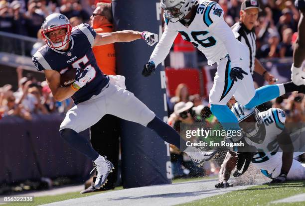 Chris Hogan of the New England Patriots goes out of bounds after making a 2-yard touchdown reception during the second quarter against the Carolina...