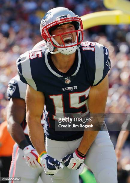 Chris Hogan of the New England Patriots celebrates after making a 2-yard touchdown reception during the second quarter against the Carolina Panthers...