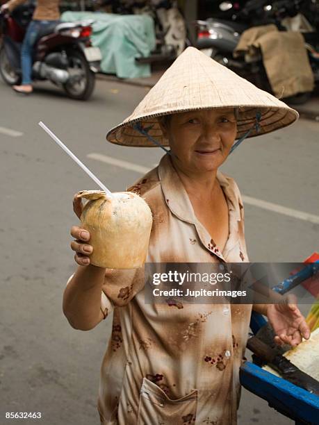 coconut vendor, vietnam - vietnamese street food stock-fotos und bilder