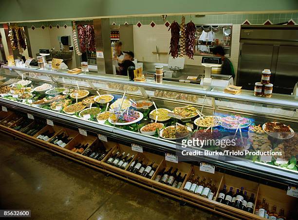 service deli in market - deli counter stock pictures, royalty-free photos & images