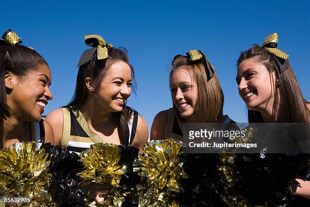 smiling cheerleaders - asian cheerleaders ストックフォトと画像