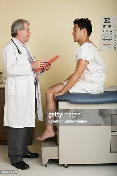doctor examining patient - doctor stethoscope patient whole body stock pictures, royalty-free photos & images