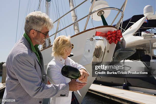 couple christening boat - botadura del buque fotografías e imágenes de stock