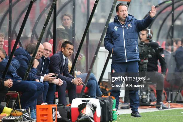 Assistant trainer Jan Wouters of Feyenoord, coach Giovanni van Bronckhorst, assistant trainer Jean-Paul van Gastel of Feyenoord during the Dutch...