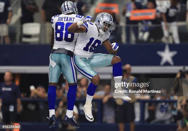 Brice Butler of the Dallas Cowboys celebrates his touchdown with Dez Bryant in the second quarter against the Los Angeles Rams at AT&T Stadium on...