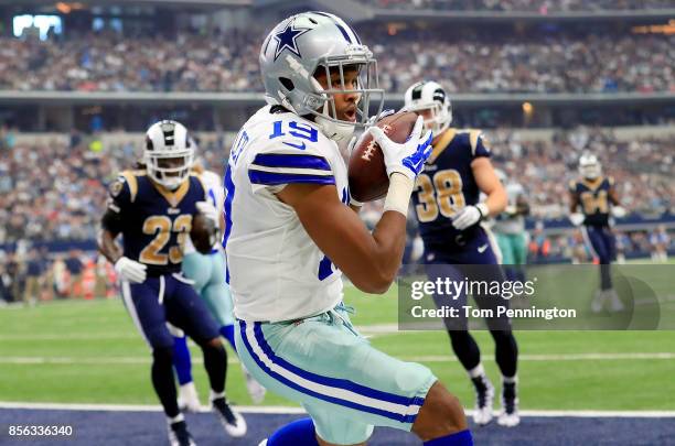 Brice Butler of the Dallas Cowboys scores a touchdown against the Los Angeles Rams in the second quarter at AT&T Stadium on October 1, 2017 in...